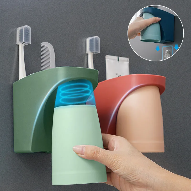 Magnetic mouthwash cup and toothbrush holder