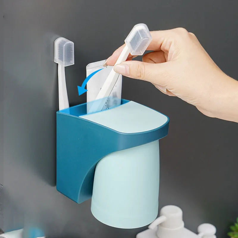 Magnetic mouthwash cup and toothbrush holder