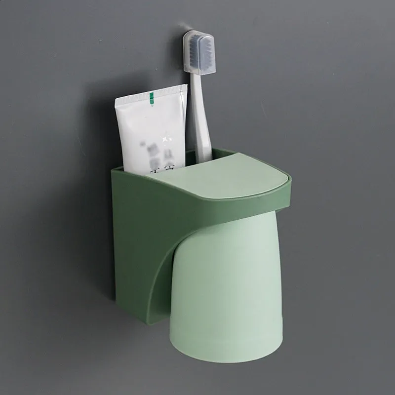 Magnetic mouthwash cup and toothbrush holder