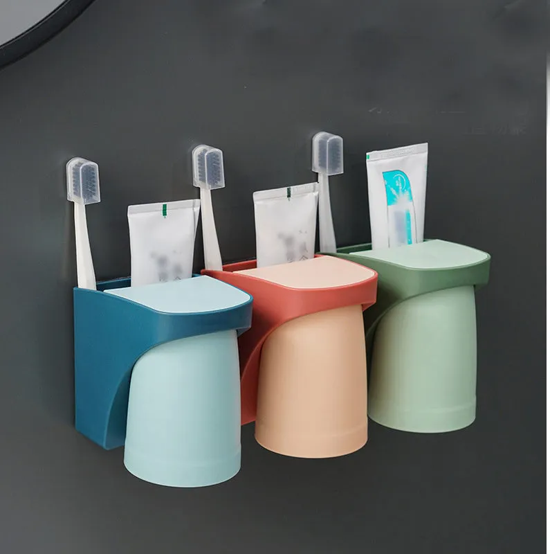 Magnetic mouthwash cup and toothbrush holder