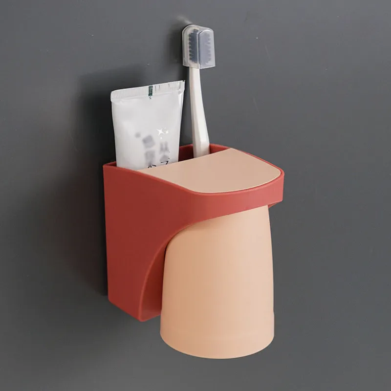 Magnetic mouthwash cup and toothbrush holder