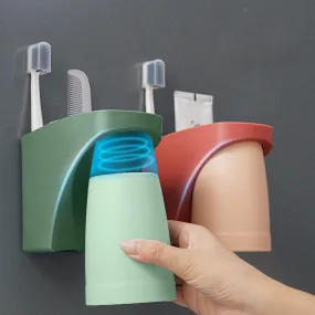 Magnetic mouthwash cup and toothbrush holder