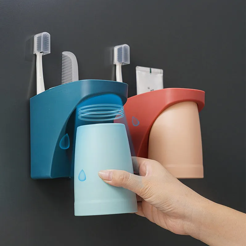 Magnetic mouthwash cup and toothbrush holder